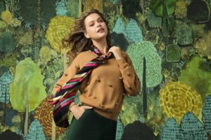 female model in front of Andrew Catanese backdrop