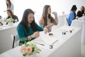 calligraphy workshop attendees at tables