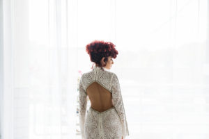 model Kayla MaDonna wearing open back wedding dress