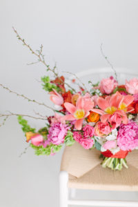 closeup of coral colored wedding floral design by Stylish Stems