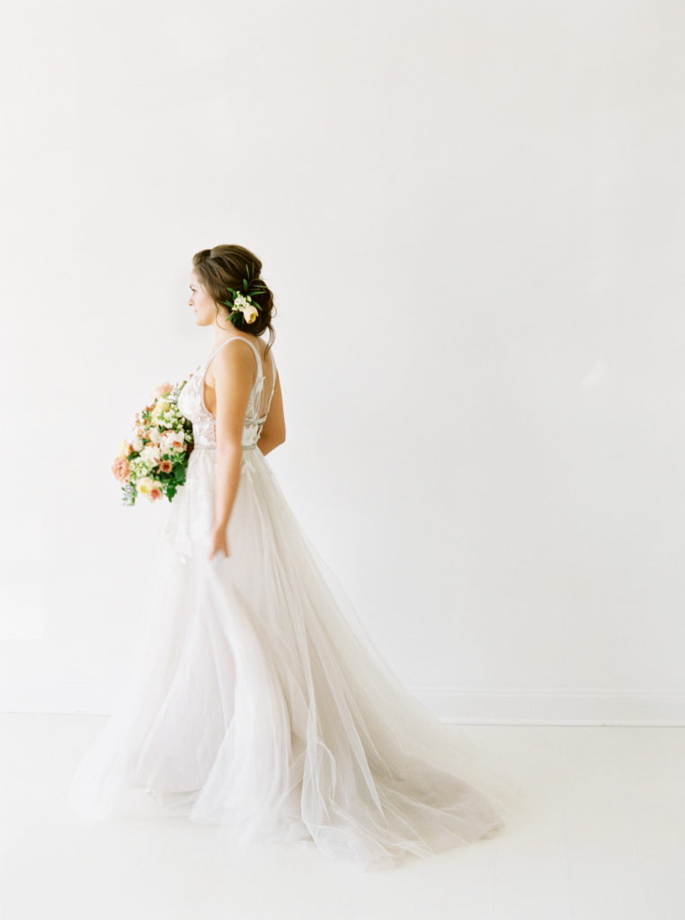 spring bride walking in white space