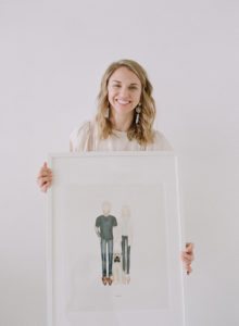 Anna Olivia photography holding framed art print