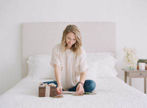 Anna Olivia sitting on bed at Park Studios Atlanta