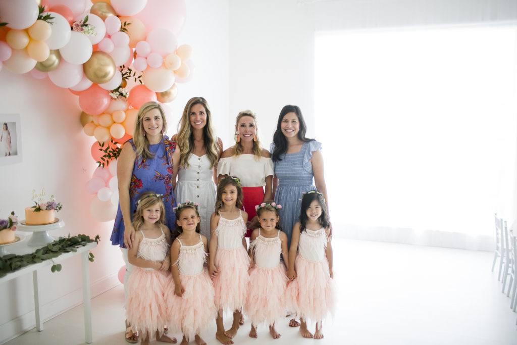 four mothers with five daughters at a birthday party