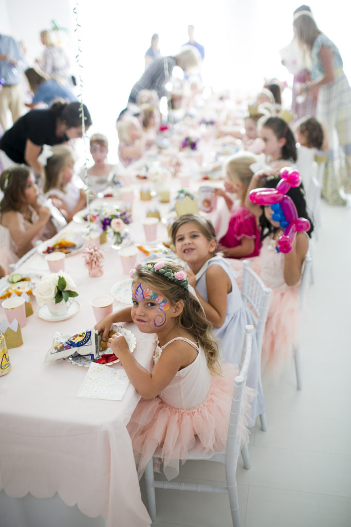 little girl with painted face and plate of food, garden tea party birthday, Atlanta